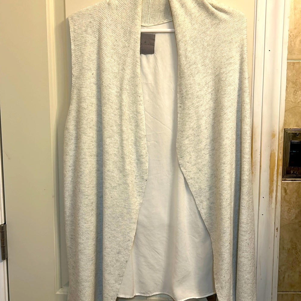 Women’s size large loose fitting vest. It looks like a two piece garment